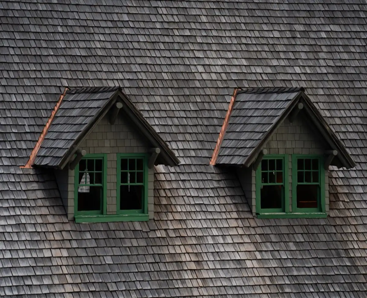 Dormers on a shingle roof in Fort Lauderdale, FL, where step flashing and kickout flashing carry water past the walls